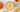 An orange mango ener-c mixed vitamin c drink surrounded by diced orange slices